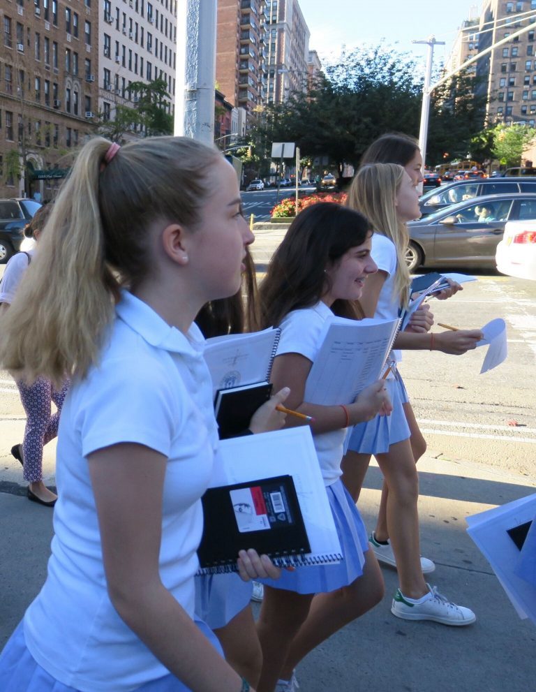 Students on a walking tour of the Upper East Side in Manhattan, sketchbooks in hand