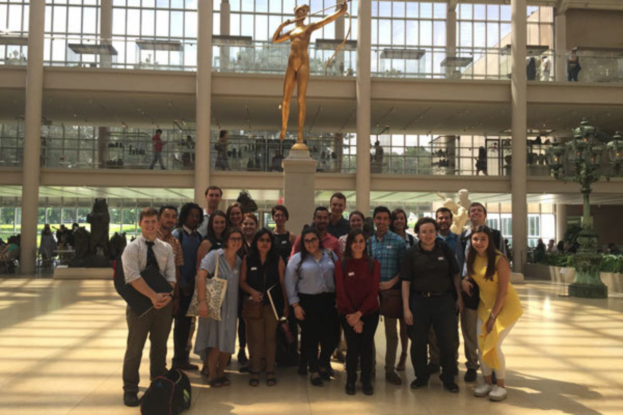 The Summer Studio group stands in front of the statue of Diana during a field study at The Metropolitan Museum of Art