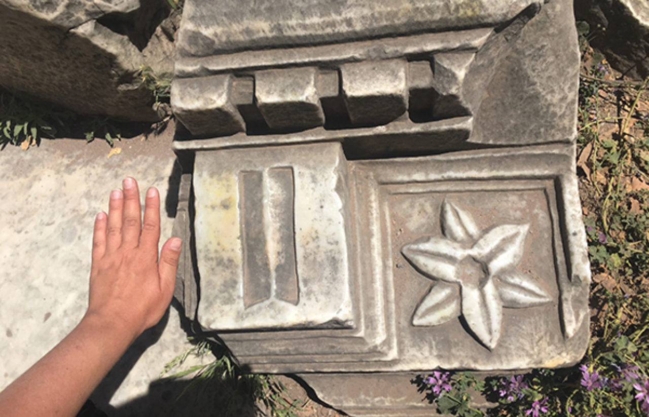 Tour participants get a close look at dentils in the Roman Forum