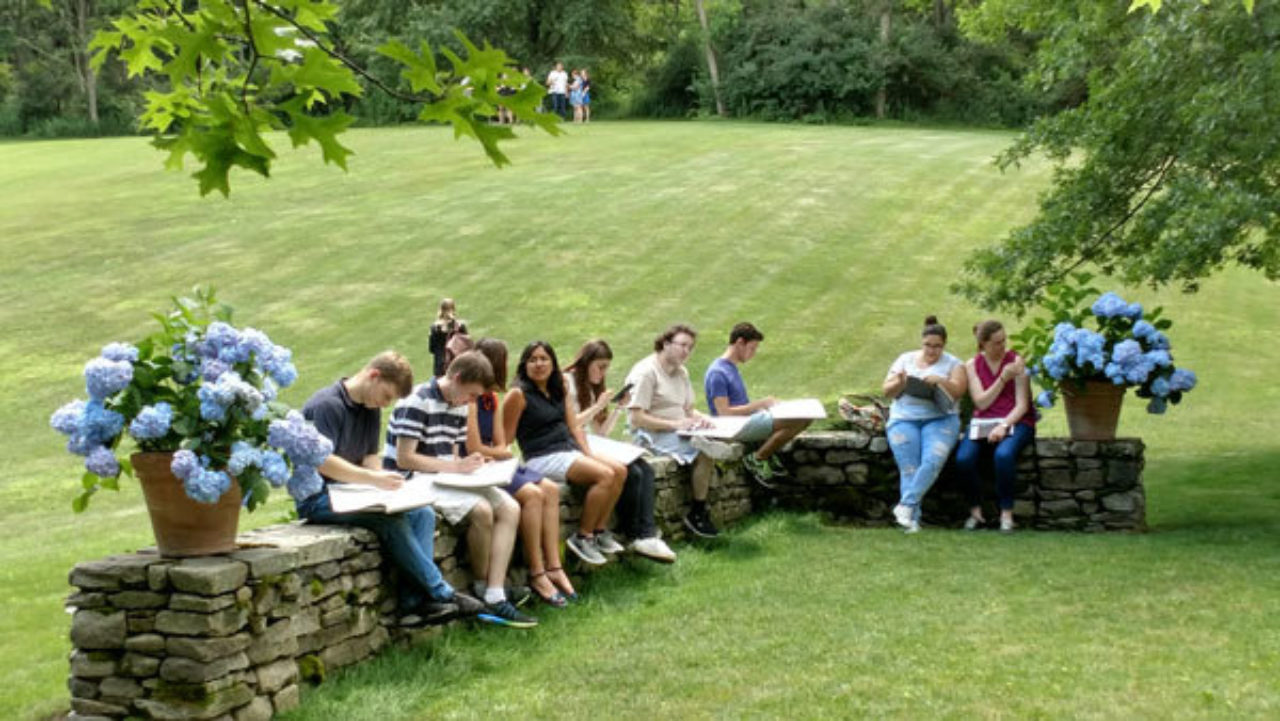 Students sketch on the grounds of architect Gil Schafer III's house