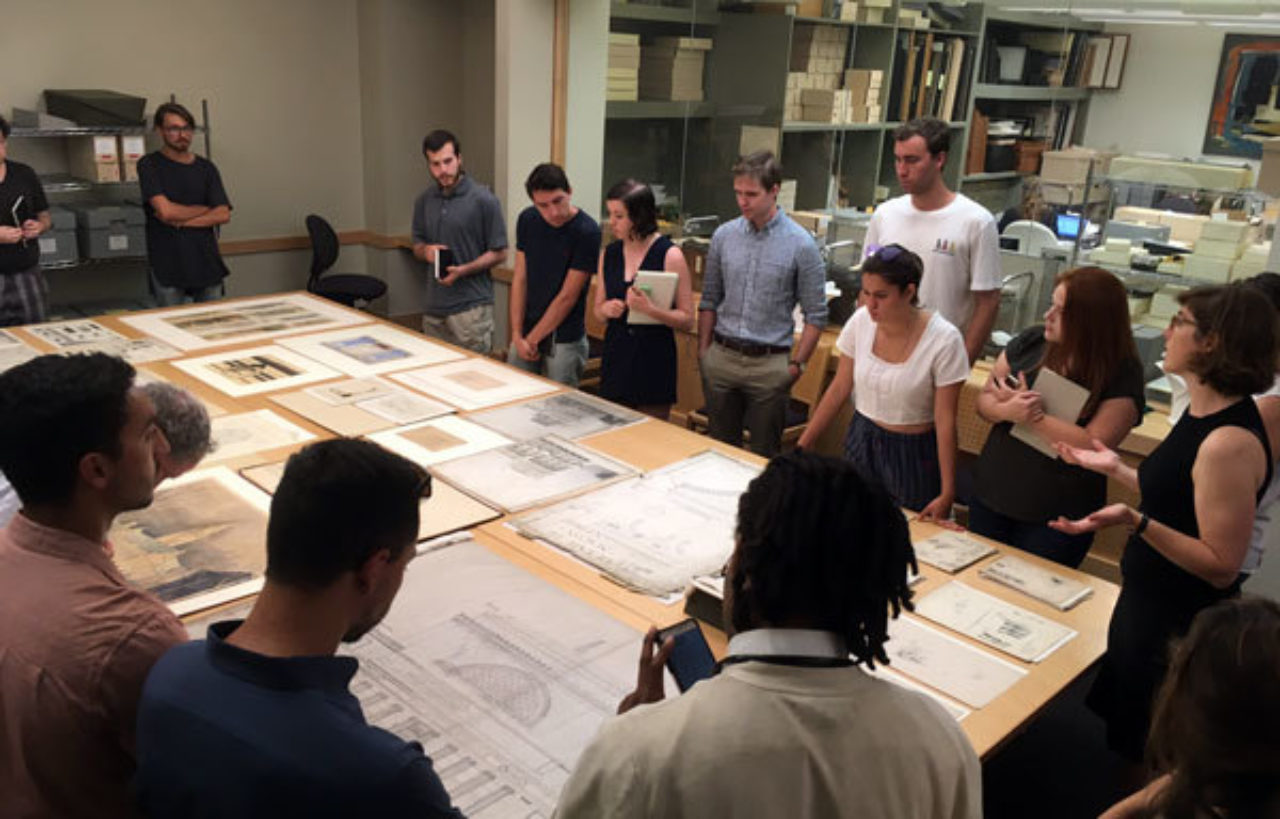 Students look at original work in the Avery Architectural and Fine Arts Library