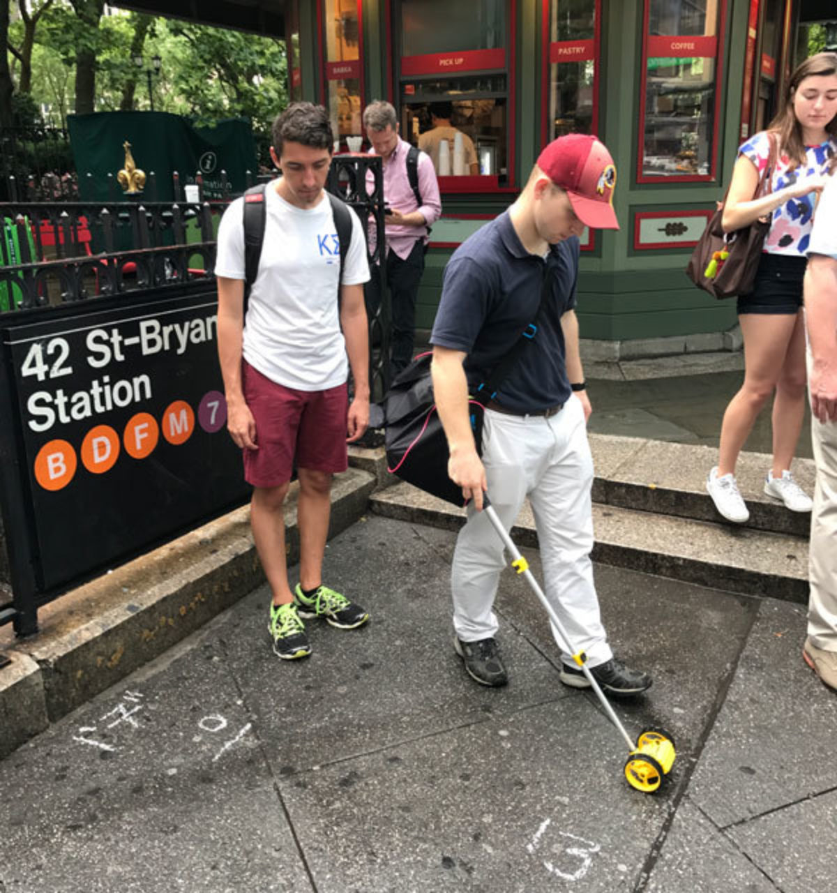 Students learn how to use measuring wheels in the field