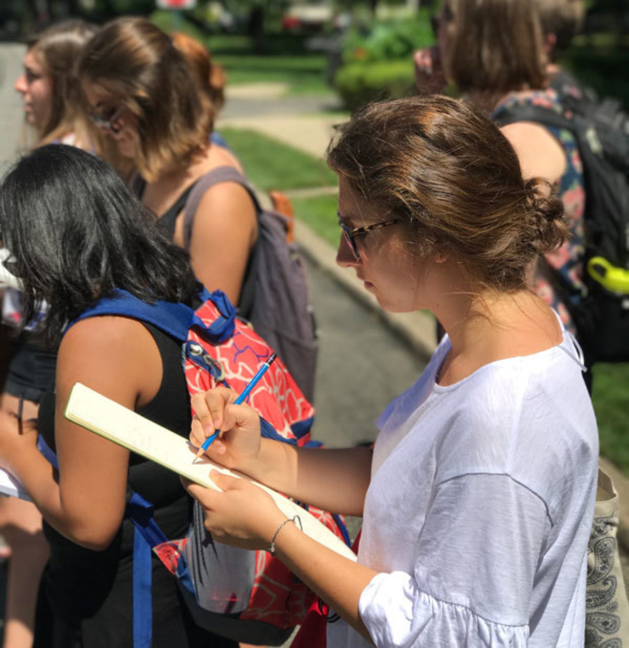 Students sketch on location at Forest Hills Gardens in Queens, NY