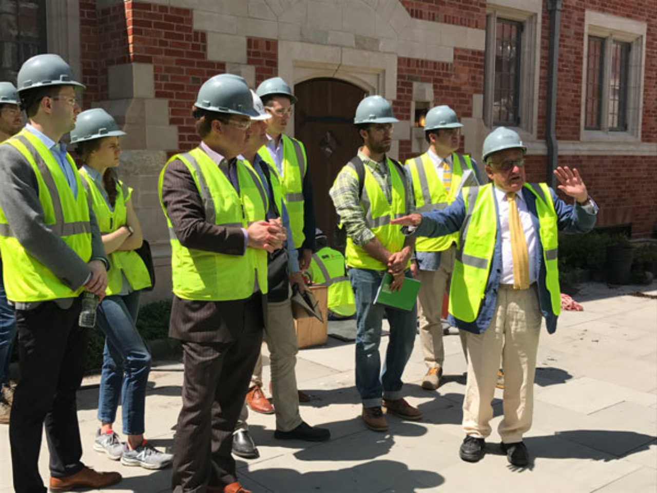 Robert A.M. Stern leads the ICAA's tour group through Yale's new residential colleges