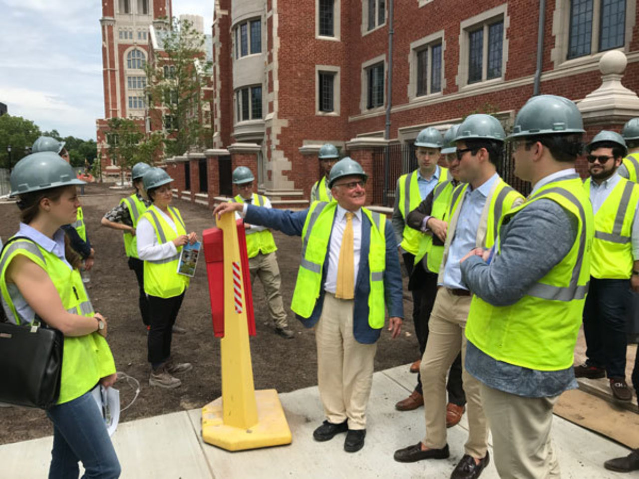 Robert A.M. Stern leads the ICAA's tour group through the new residential colleges