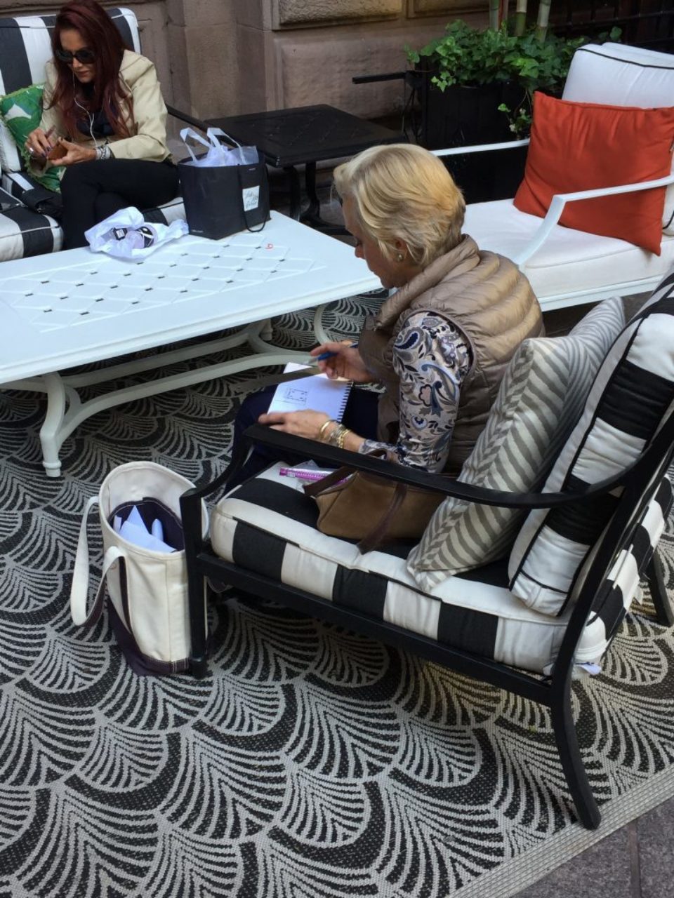 Students stop to sketch a courtyard near Rockefeller plaza