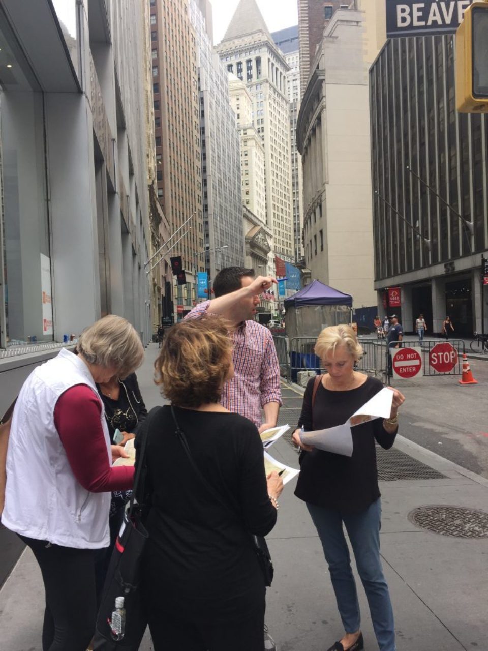 Instructor Rodrigo Bollat Montenegro points out features of a nearby facade