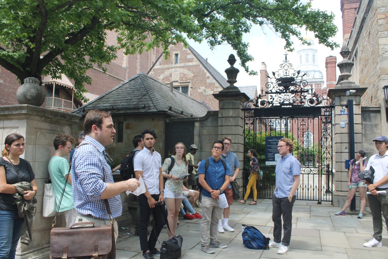 Instructor Clay Hayles teaching students about Yale's campus